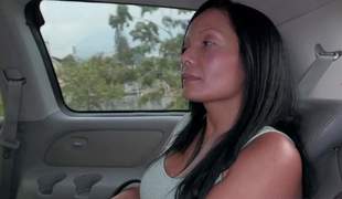 Raven haired busty Colombian mommy Casandra is proud of her perfect giant fake boobs. Thats why this babe takes off her stingy apex and bra in the back of a car in front of the camera with no shame!