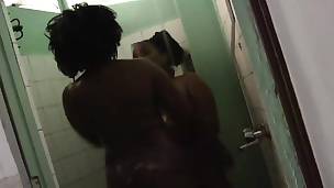 Two lustful booty African lesbians havng fun under the shower